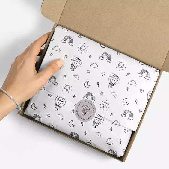 Tissue paper wrapping individual items in subscription box